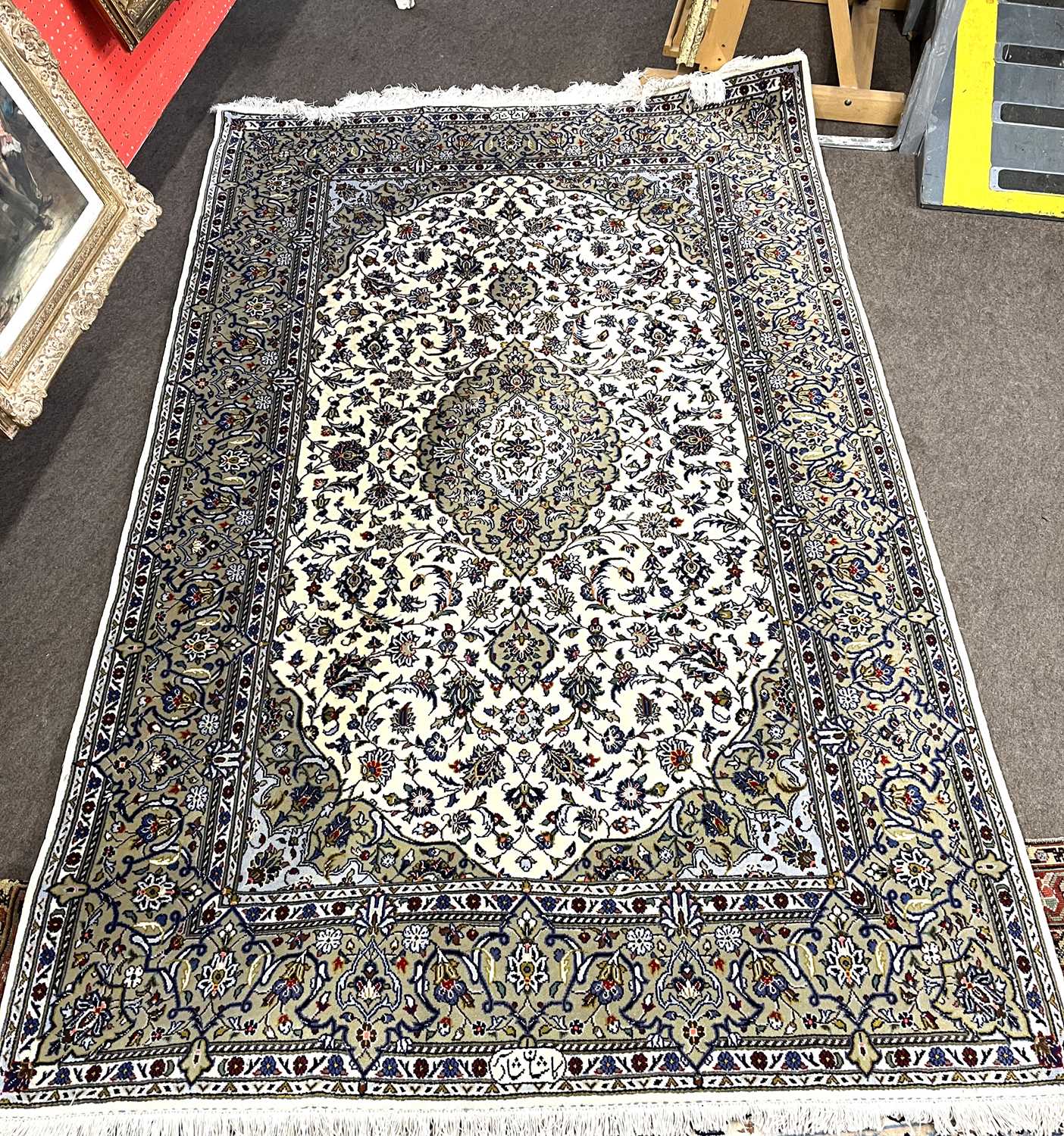 A floral decorated Iranian silk mix floral carpet 140 x 240cm
