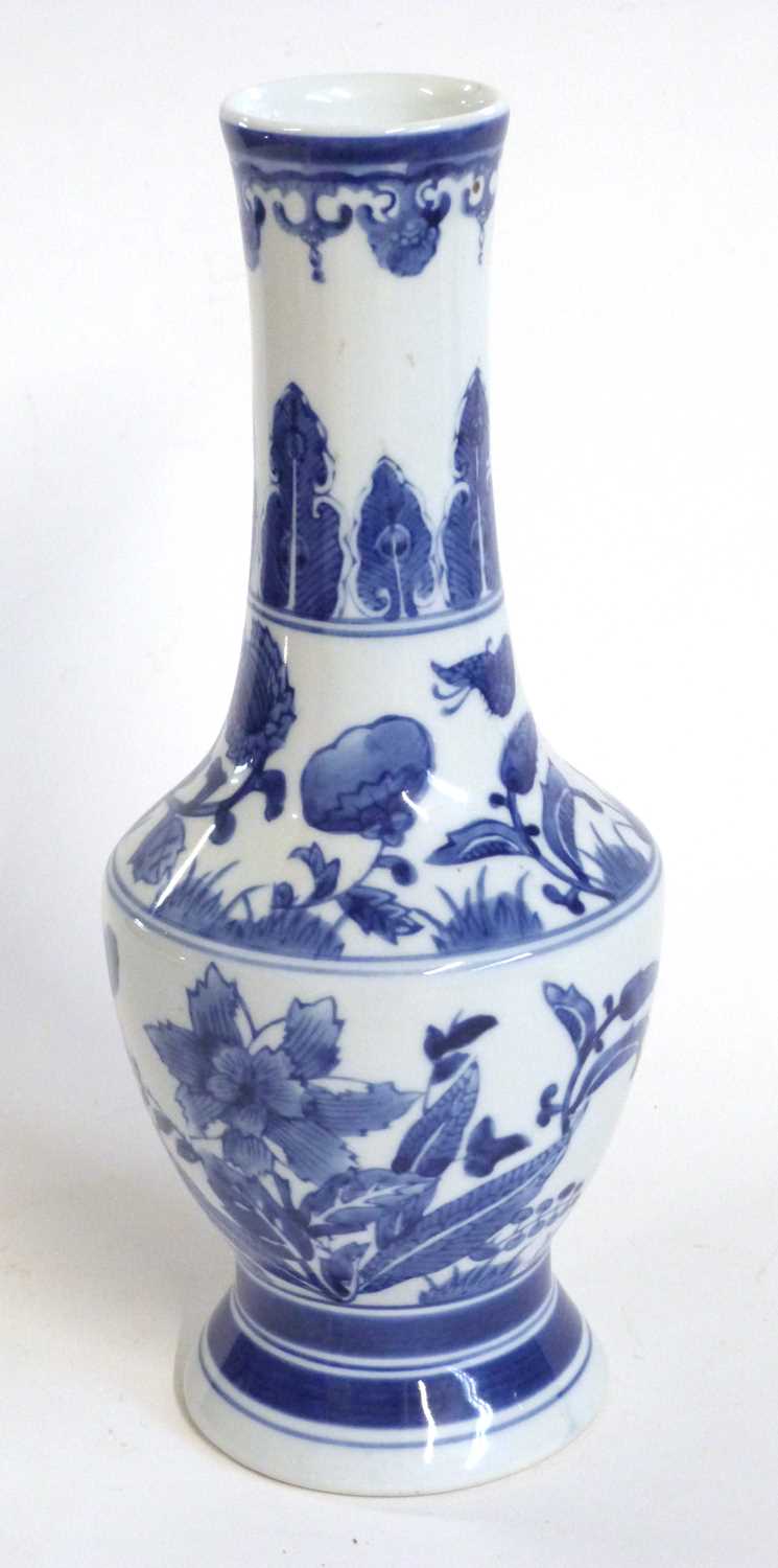 A Chinese porcelain vase, 20th Century with a painted blue and white floral design, 32cm high - Image 5 of 9