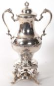 A large samovar silver plated tea urn, in twin handled trophy form with floral banded body, ornate