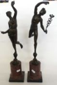A pair of classical figures, one of Hercules and one further mounted on circular onyx bases