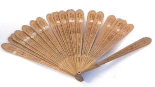 A wooden fan in original case with inscription which reads "Given to Mrs Chapman as belonging to her