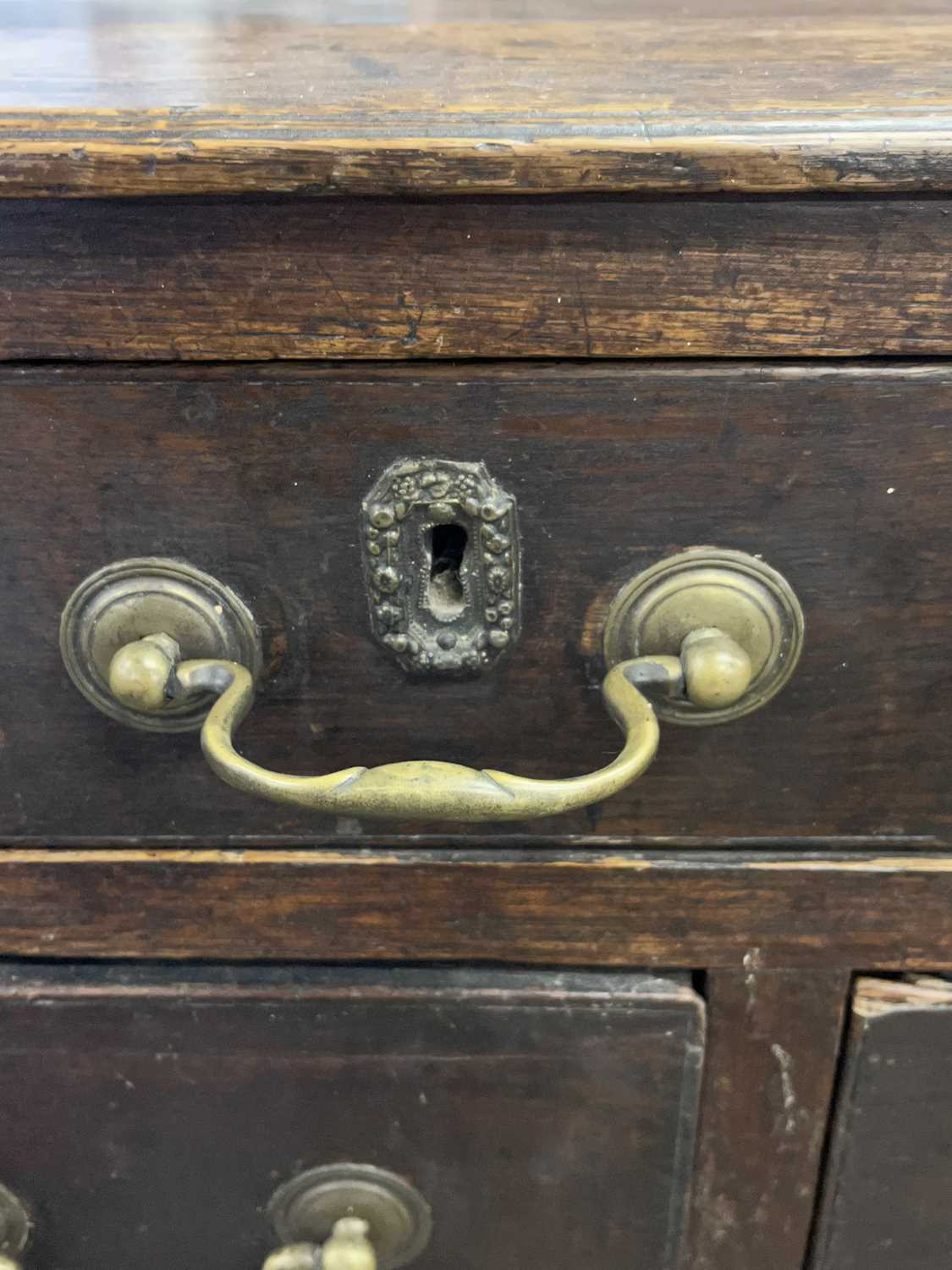 A Georgian oak chest of drawers with an unusual configuration of seven short and one long drawer, - Image 3 of 3