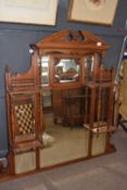 Late Victorian American walnut over mantel mirror with eight panels of bevelled glass surrounded