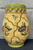 A Crown Ducal vase of baluster form with two blind floral decoration by Charlotte Rhead, 23cm high