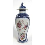 Late 18th Century Chinese export vase with polychrome decoration of flowers within blue and white