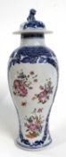 Late 18th Century Chinese export vase with polychrome decoration of flowers within blue and white