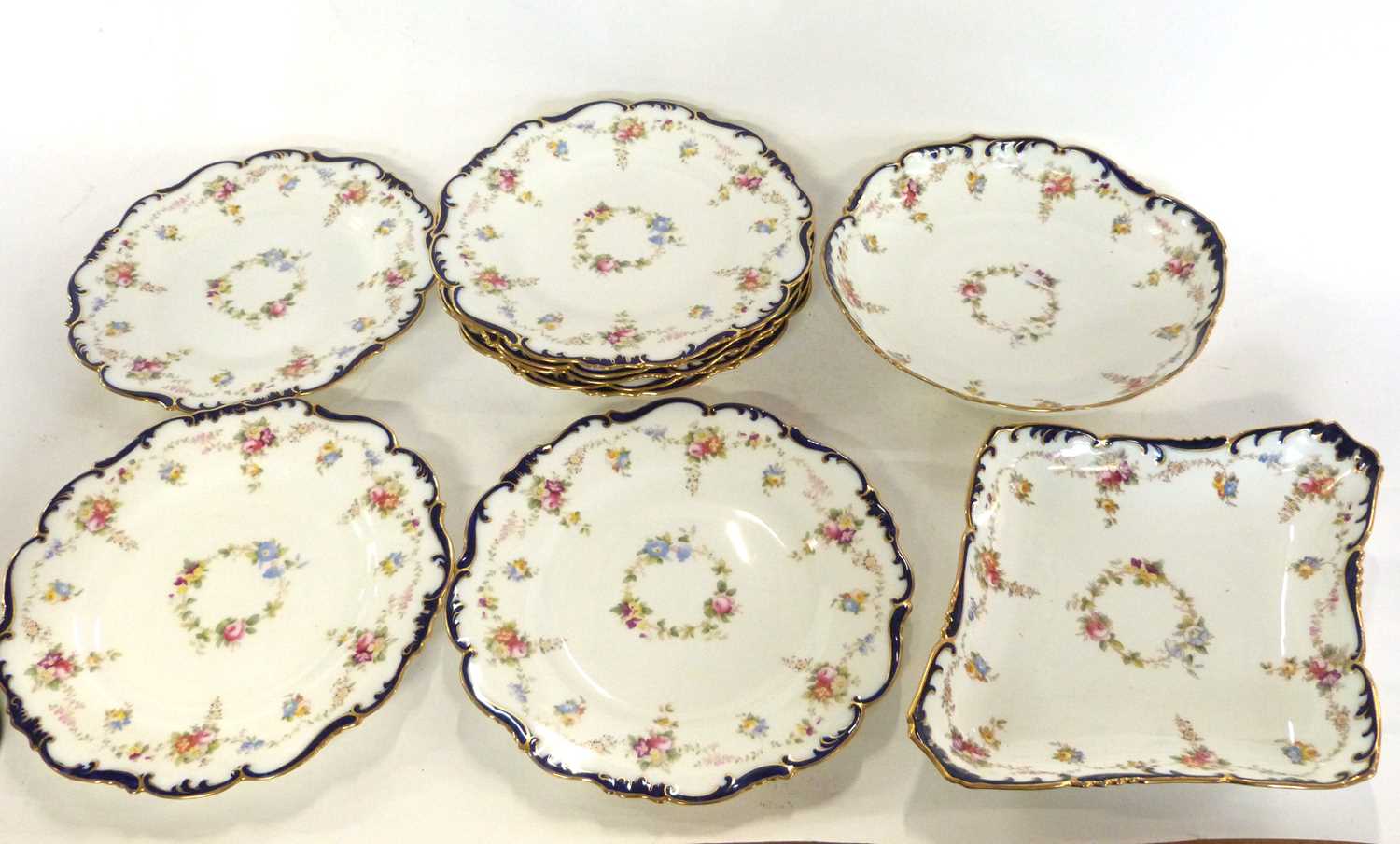 Quantity of Cauldon tea wares, all with printed floral designs within blue scroll borders,