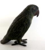 A green painted Spelter model of a parrot, 15cm high