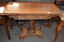 A late Georgian mahogany fold top card table raised on a tapering stem with four bun feet, 91cm