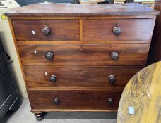A Victorian mahogany chest of two short over three long drawers fitted with turned knob handles,