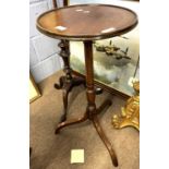 19th Century mahogany tripod based wine table with circular top over a raised column, top 36cm