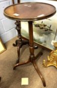 19th Century mahogany tripod based wine table with circular top over a raised column, top 36cm
