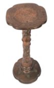 A Chinese bronze jardiniere stand, probably later adapted from a sundial, with a lobed top over a