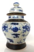 Chinese crackle ware vase and cover, the vase decorated in blue and white with dragon chasing the