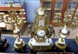19th Century French Empire style clock garniture, comprising a clock in Empire style with two