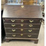 A Georgian mahogany bureau with fitted interior over four long drawers and bracket feet, 90cm wide