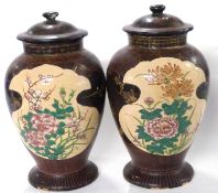 An unusual pair of Satsuma vases and covers, the brown ground with ochre panels decorated with