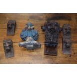 A set of four antique small carved bracket supports with lion masks together with an antique oak