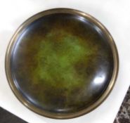 A bronzed effect metal tray, 23cm diameter