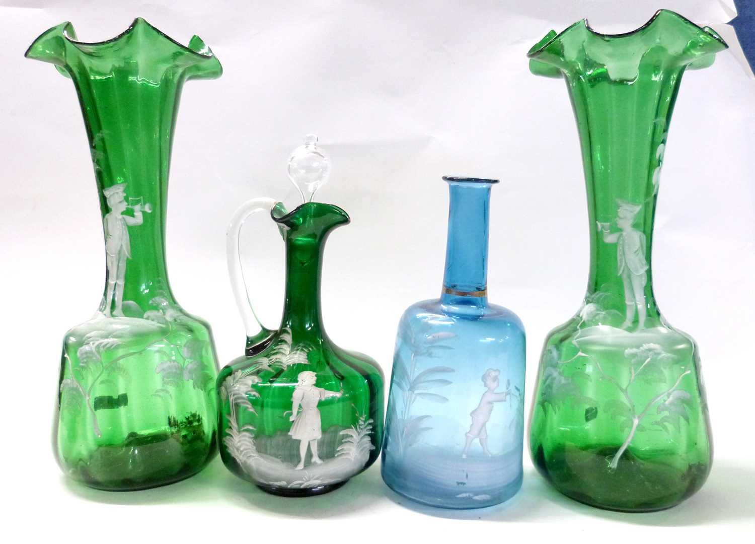 A group of glass wares with Mary Gregory type painted decoration of children including two green