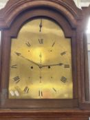 Saddleton, Lynn - A Georgian long case clock with arched brass dial and an eight day movement, set