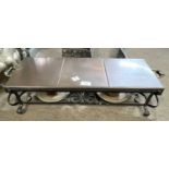 Copper topped table warming stand with two burners set on an iron frame, 70cm wide