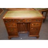 Arthur Brett of Norwich - A reproduction mahogany veneered knee hole desk with green leather writing