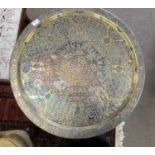 An early 20th Century Egyptian brass serving tray with accompanying turned wooden stand, the tray