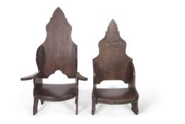 Jack Grimble of Cromer - A pair of ladies and gents oak throne style chairs with arched backs, the