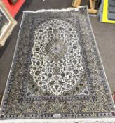 A floral decorated Iranian silk mix floral carpet 140 x 240cm