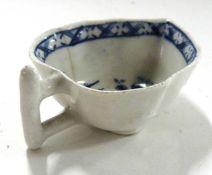 Small Lowestoft butter boat with Chinoiserie blue and white design, raised on three clover leaf