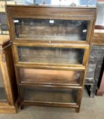 An early 20th Century Gunn four section bookcase cabinet with glazed doors, 87cm wide