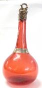 A ruby coloured glass decanter late 19th Century with copper cover impressed with oak leaves, 30cm