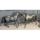 A pair of modern bronze horses in naturalistic poses, 57cm high, maximum 80cm long