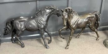 A pair of modern bronze horses in naturalistic poses, 57cm high, maximum 80cm long
