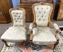 A pair of Victorian lady and gent's upholstered chairs, the frames with carved floral decoration and