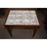 A 20th Century mahogany rectangular coffee table, the top inset with twelve 18th Century Dutch delft
