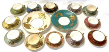 A part mid 19th Century Minton tea set, the stippled coloured grounds decorated in relief with