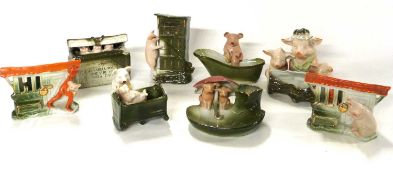 Box containing a quantity of novelty pig figures