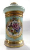 A continental porcelain cylindrical jar and cover, the central panel painted with flowers within