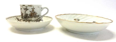 A Lowestoft porcelain cup and saucer with sepia and gilt decoration together with a spiral gilt