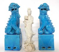Pair of Chinese pottery dogs of fo with turquoise glaze together with a Blanc de Chine figure of