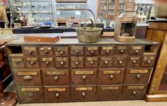 19th century bank of apothecary drawers, 160cm wide The drawers appear to have been used in a shed.