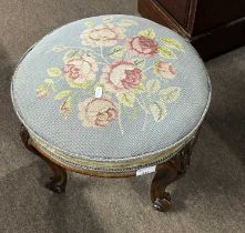 Victorian circular stool with rose tapestry top raised on four short cabriole legs, top 40cm diam