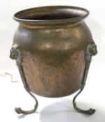Early 20th century brass jardiniere of ovoid form set on three legs with brass lion mask detail