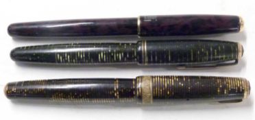 Three vintage Parker fountain pens with gold nibs, one marked 'Parker Sonnet France'