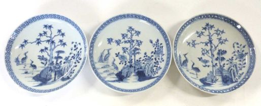 Group of three 18th Century Chinese porcelain dishes with decoration of birds amongst trees, 21cm