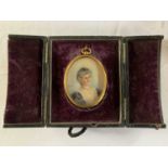 Oval portrait miniature, circa early 20th century, hand painted on bone, initialed 'E.M.S.', loosely