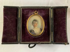 Oval portrait miniature, circa early 20th century, hand painted on bone, initialed 'E.M.S.', loosely