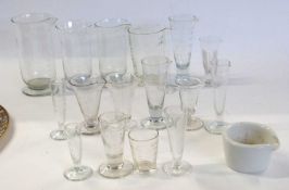 Tray containing quantity of measuring jugs for chemists etc, all with engraved calibration